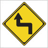 左への背向屈曲を表す道路標識