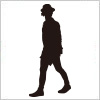 帽子をかぶって歩く若い男性のシルエット・影絵素材